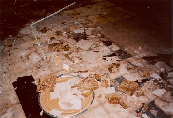 Damaged floor tile in work area