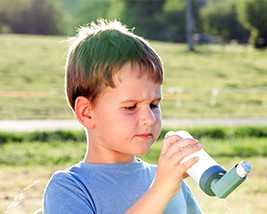 A child uses an inhaler