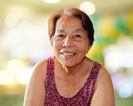 An older woman smiling