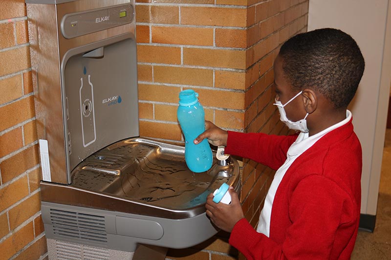 Kid at hydration station