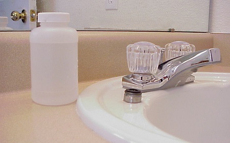 Sampling bottle next to a sink