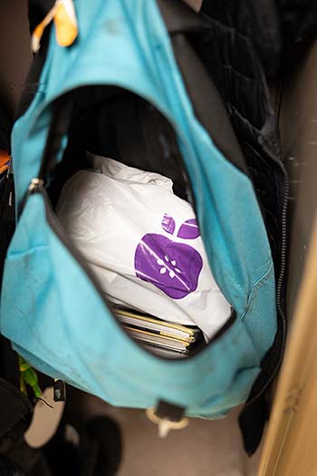 An every meal package sits in an open backpack in a locker
