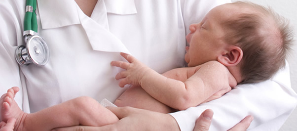doctor holding newborn